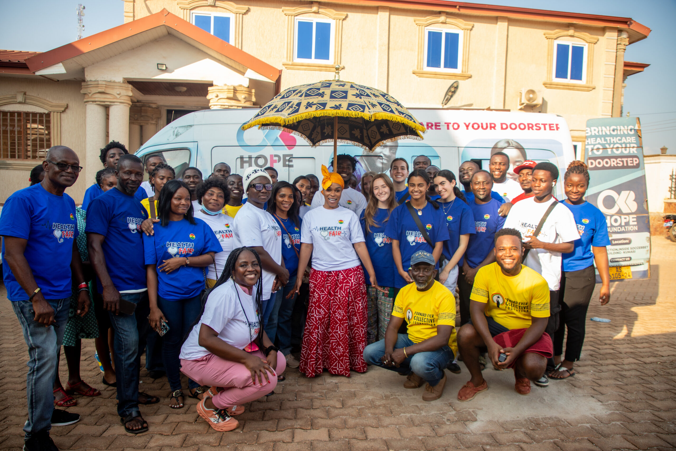 Volunteers, health partners, and community members at a Kumasi health fair